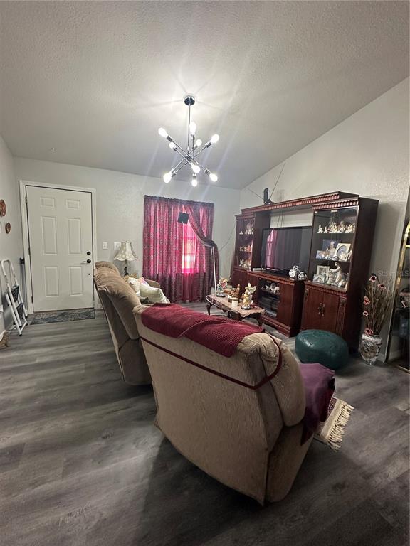 50 Larch Run Ocala, FL 34480 - Photo 3 of 12 a living room with furniture and a dining table with kitchen view