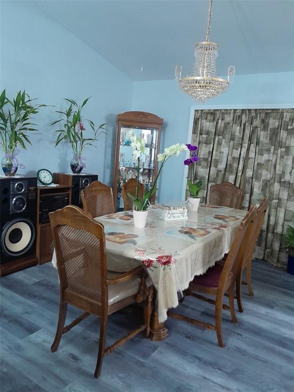50 Larch Run Ocala, FL 34480 - Photo 4 of 12 a view of a dining room with furniture and wooden floor