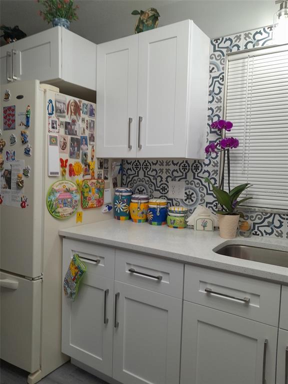 50 Larch Run Ocala, FL 34480 - Photo 7 of 12 a kitchen with a sink and cabinets