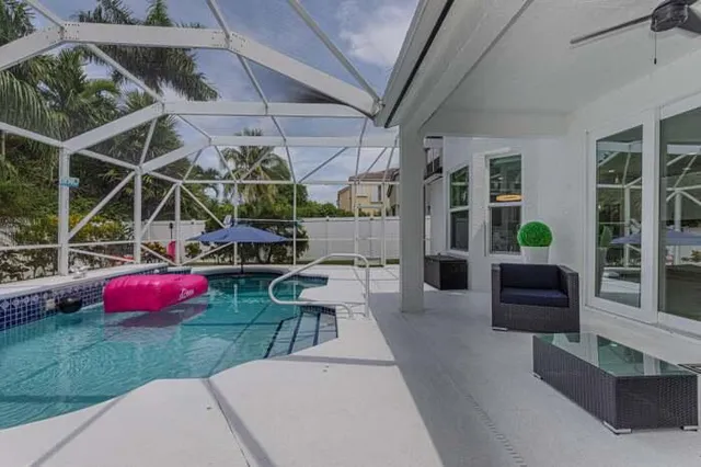 a view of a backyard with pathway