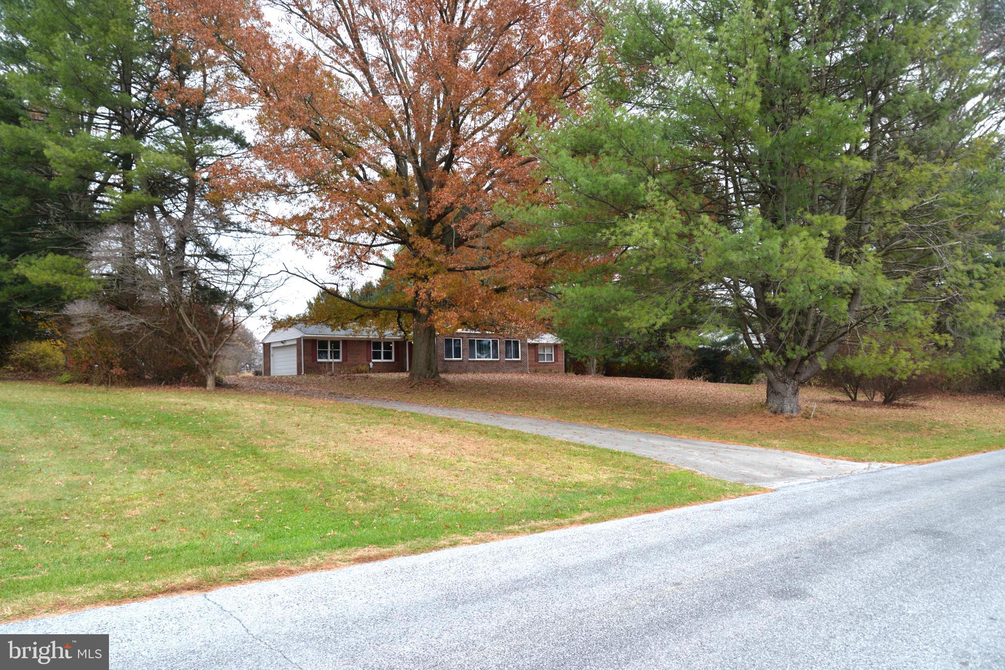 208 Faggs Manor Road Cochranville, PA 19330 - Photo 11 of 35 Charming home nestled among vibrant trees.