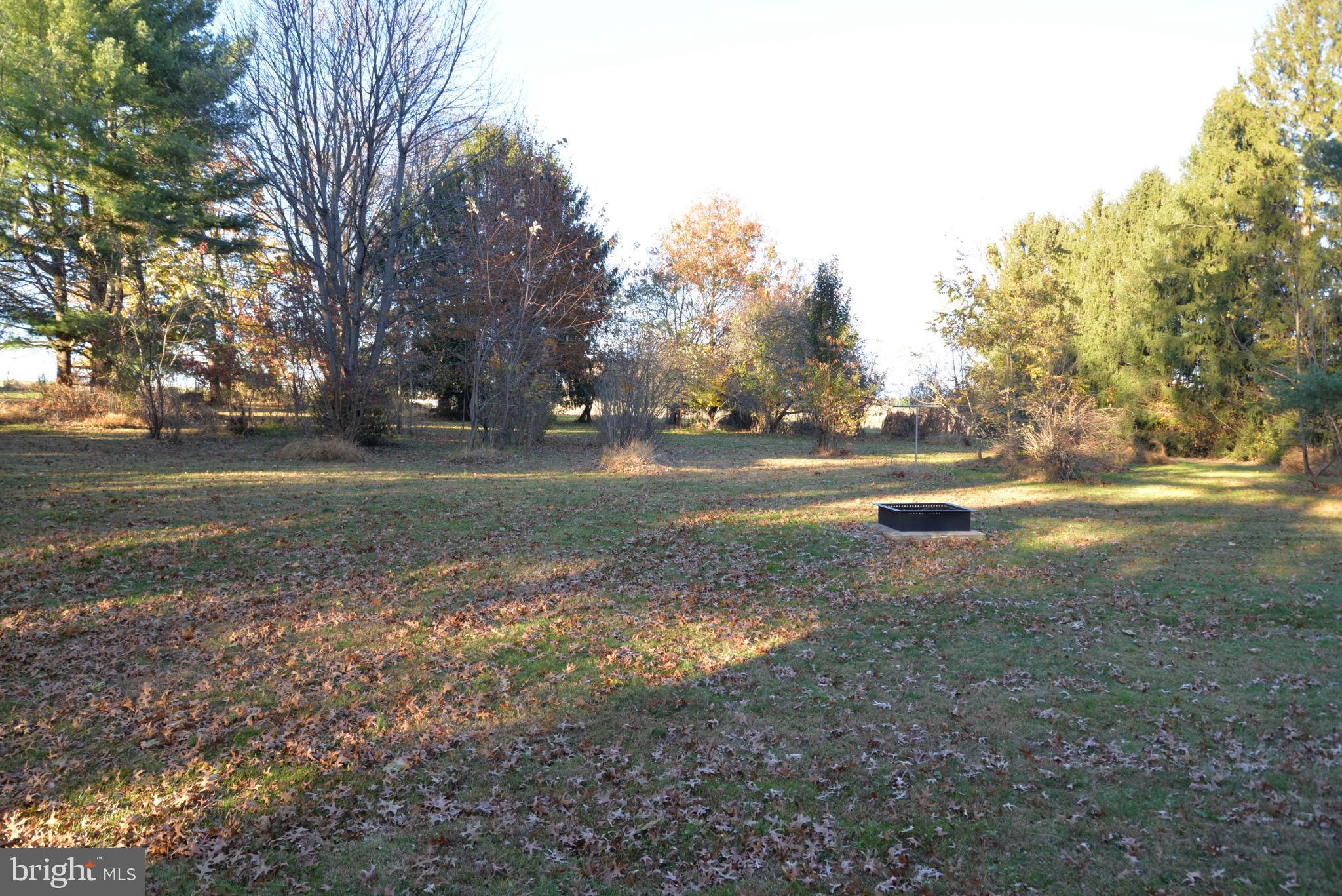 208 Faggs Manor Road Cochranville, PA 19330 - Photo 12 of 35 Serene autumn landscape with scattered leaves.