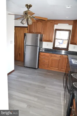 a kitchen with a refrigerator and a sink
