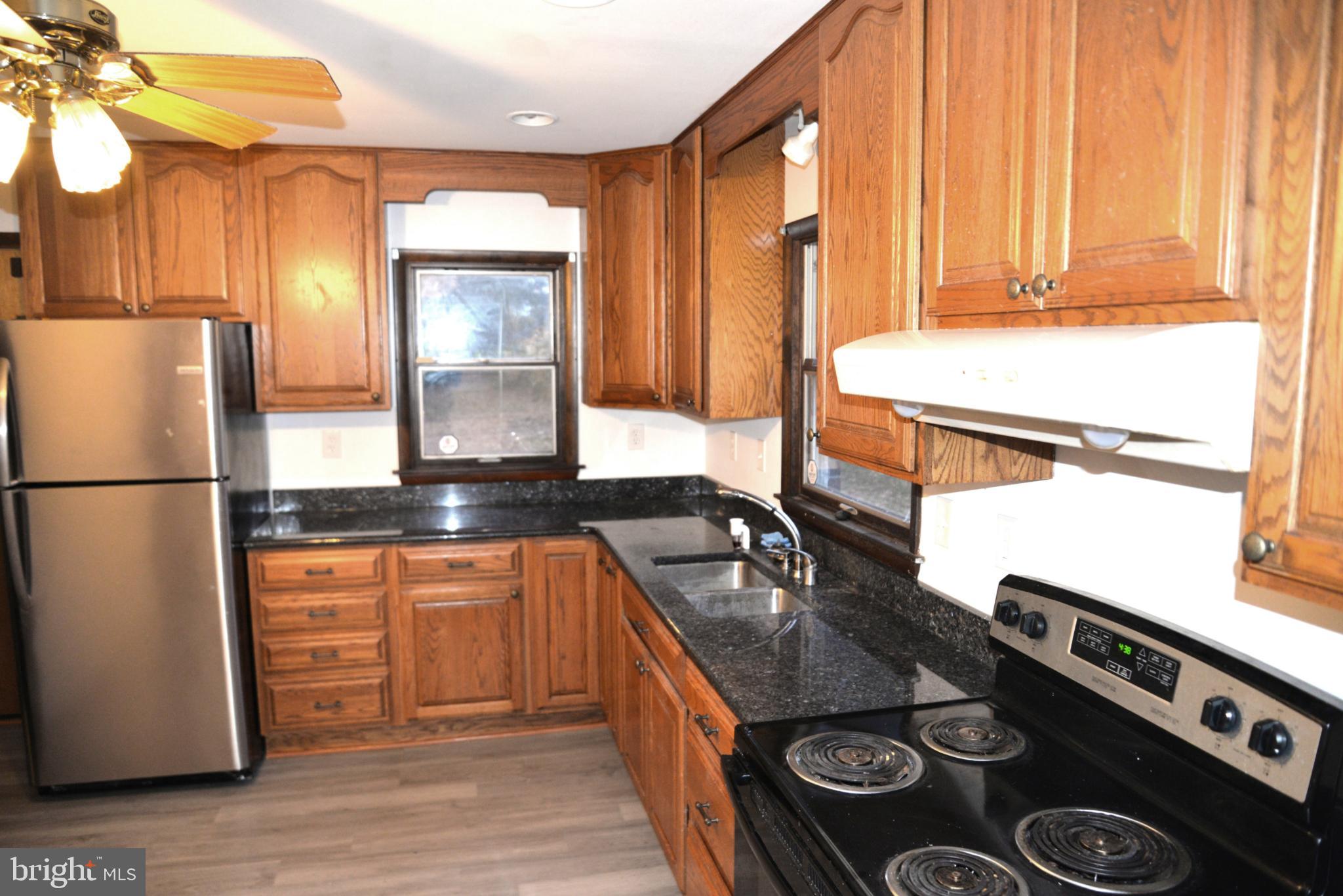 208 Faggs Manor Road Cochranville, PA 19330 - Photo 20 of 35 Warm wood tones in a classic kitchen space.