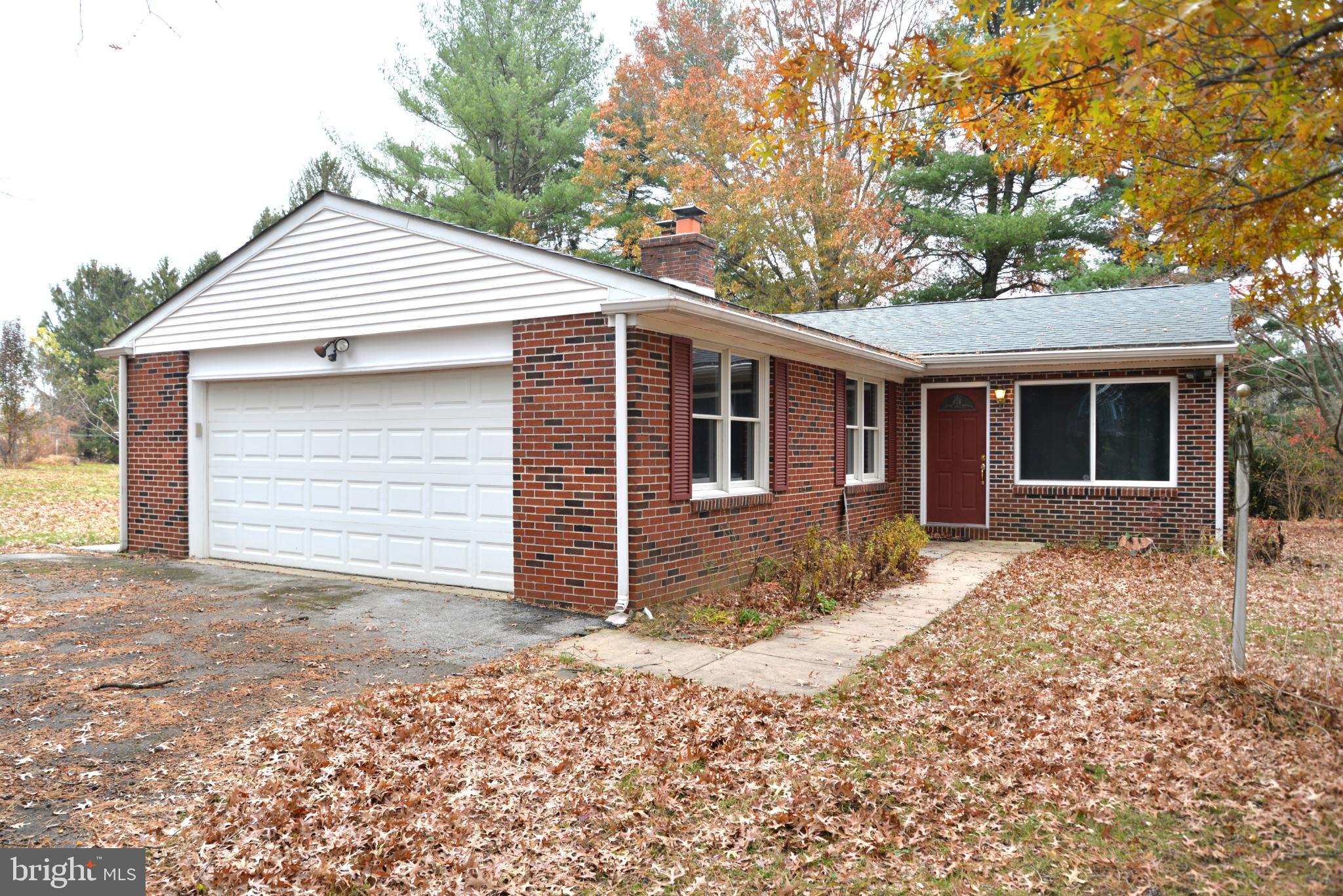 208 Faggs Manor Road Cochranville, PA 19330 - Photo 2 of 35 Charming brick home amidst autumn leaves.