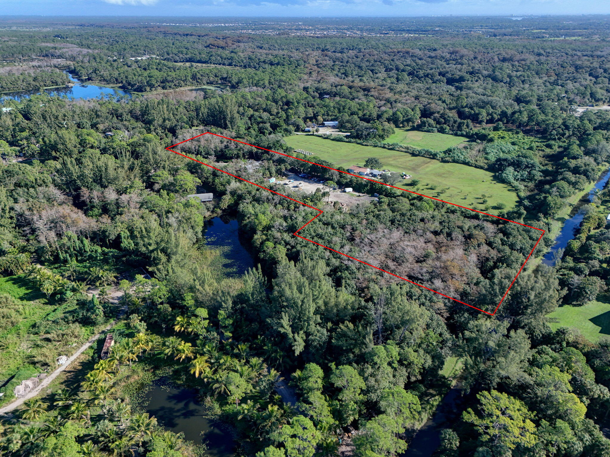9576 171st Street North Jupiter, FL 33478 - Photo 23 of 36 an aerial view of forest