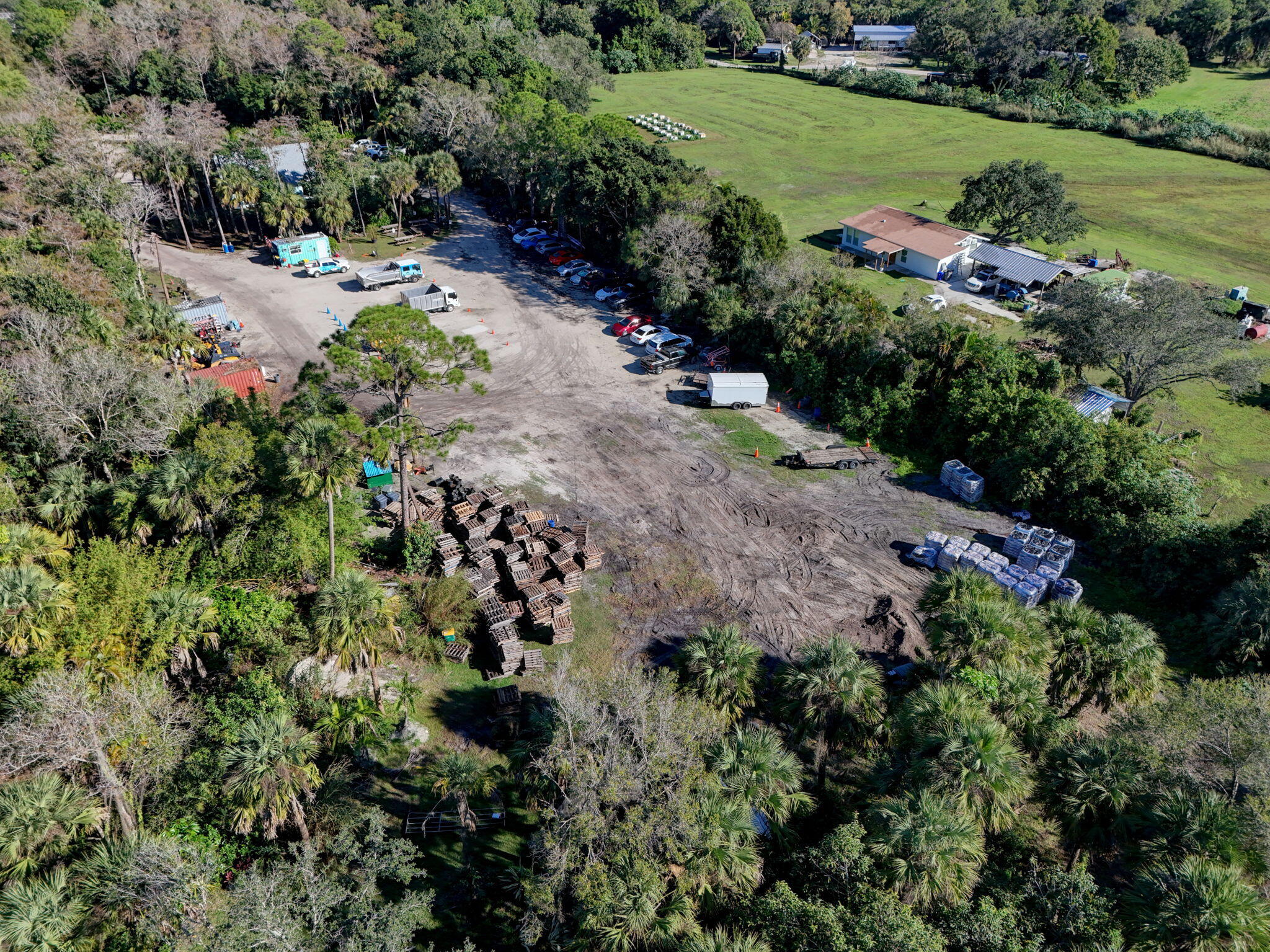 9576 171st Street North Jupiter, FL 33478 - Photo 24 of 36 an aerial view of residential house with outdoor space and trees all around