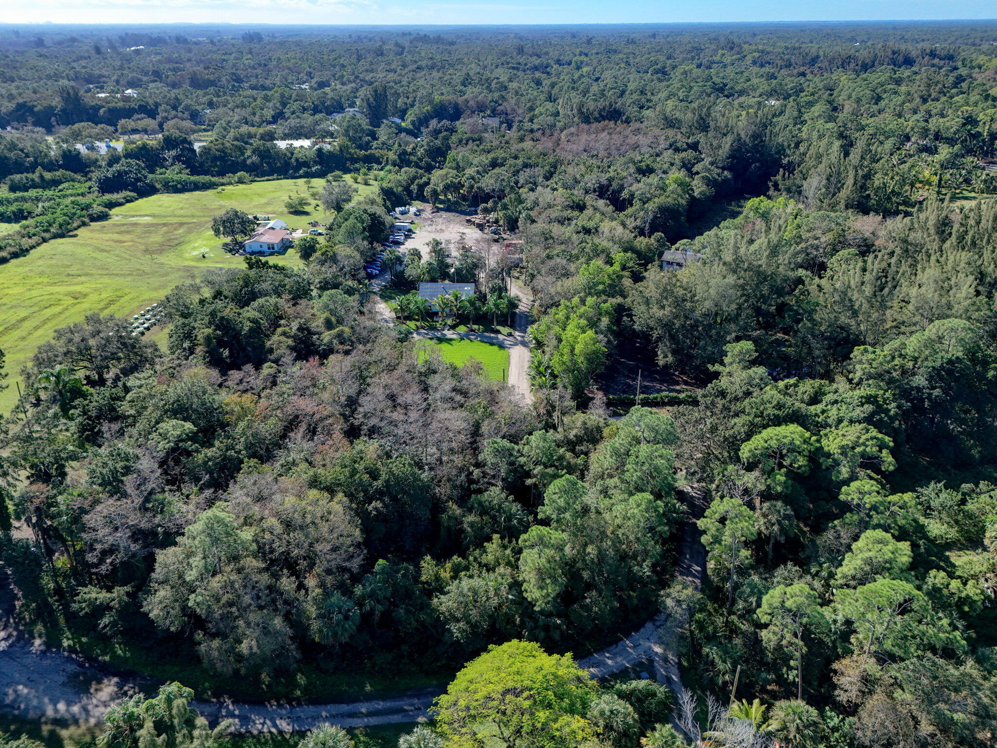 9576 171st Street North Jupiter, FL 33478 - Photo 28 of 36 an aerial view of residential house with outdoor space and trees all around