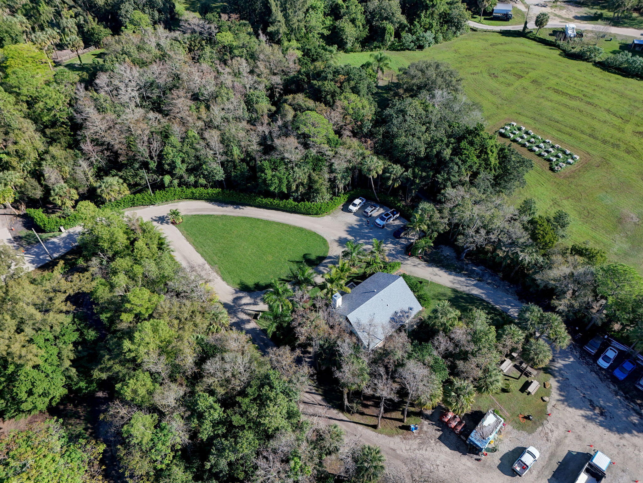 9576 171st Street North Jupiter, FL 33478 - Photo 3 of 36 an aerial view of a house with a yard
