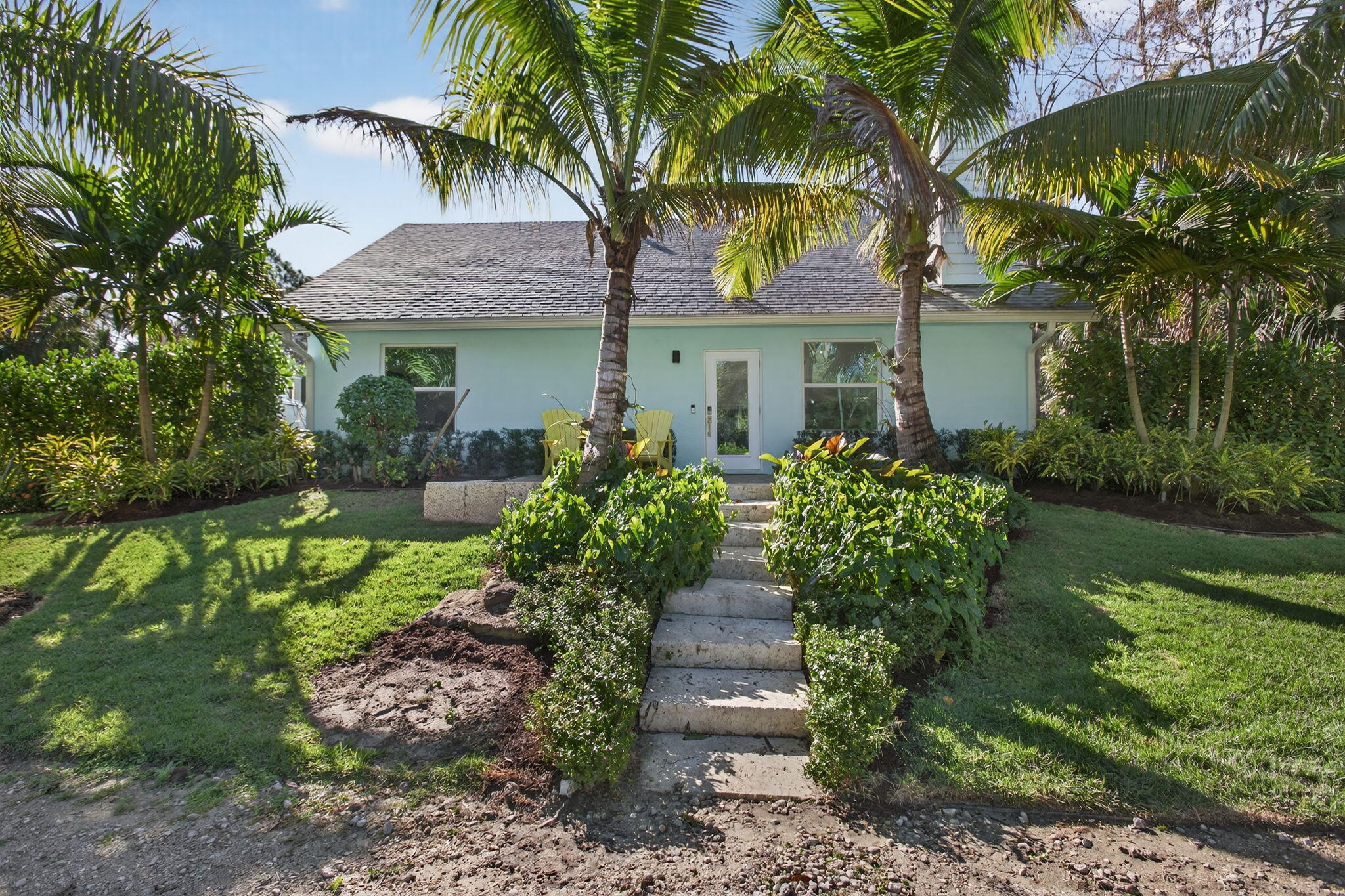 9576 171st Street North Jupiter, FL 33478 - Photo 4 of 36 a front view of house with yard and green space