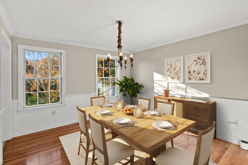 23 Morrison Lane Westford, MA 01886 - Photo 11 of 37 a view of a dining room with furniture window and wooden floor