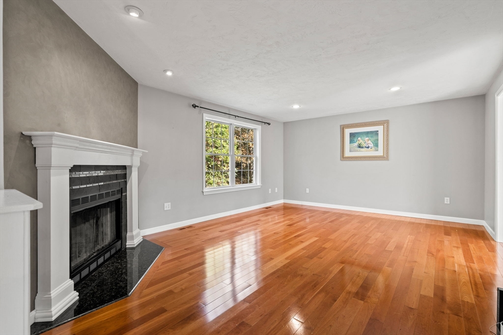 23 Morrison Lane Westford, MA 01886 - Photo 15 of 37 an empty room with windows and fireplace