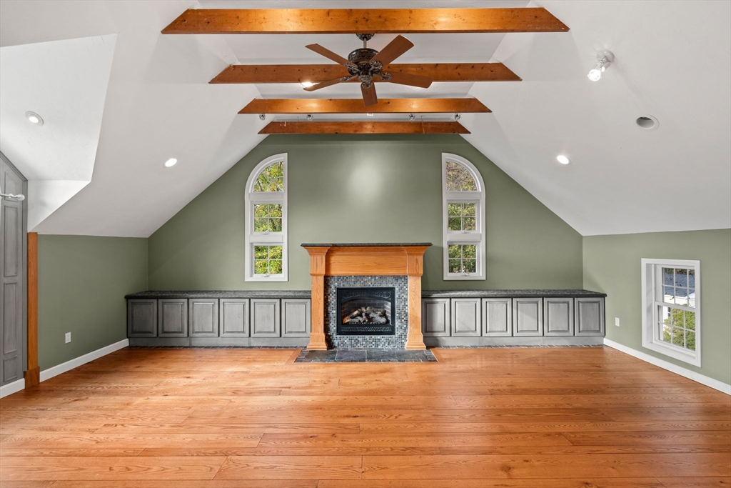 23 Morrison Lane Westford, MA 01886 - Photo 18 of 37 a view of an empty room with a fireplace and a window