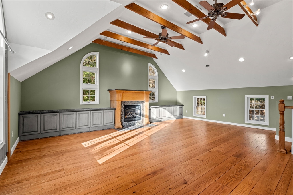23 Morrison Lane Westford, MA 01886 - Photo 20 of 37 a view of an empty room with wooden floor and a fireplace