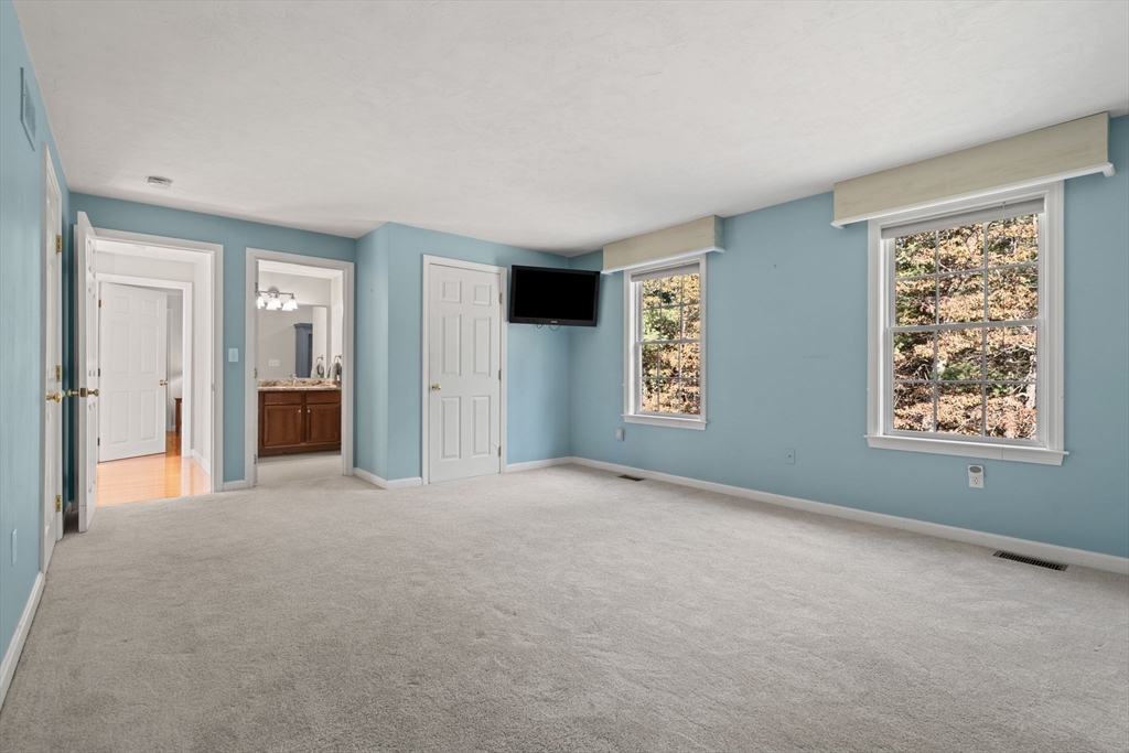 23 Morrison Lane Westford, MA 01886 - Photo 27 of 37 a view of a big room with windows and cabinet