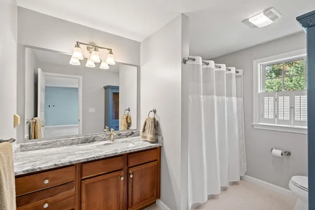 a bed room with a bed and window