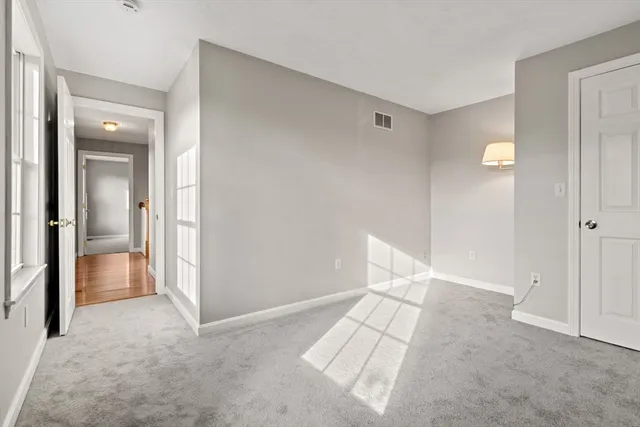 a view of a room with wooden walls