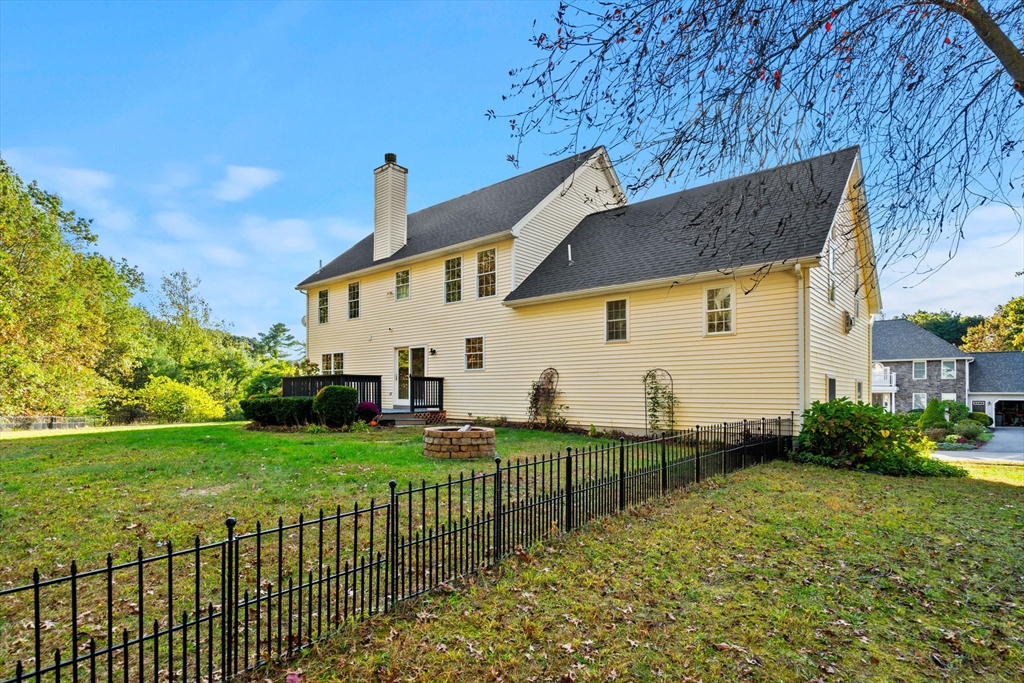 23 Morrison Lane Westford, MA 01886 - Photo 5 of 37 a view of a house with backyard and couches