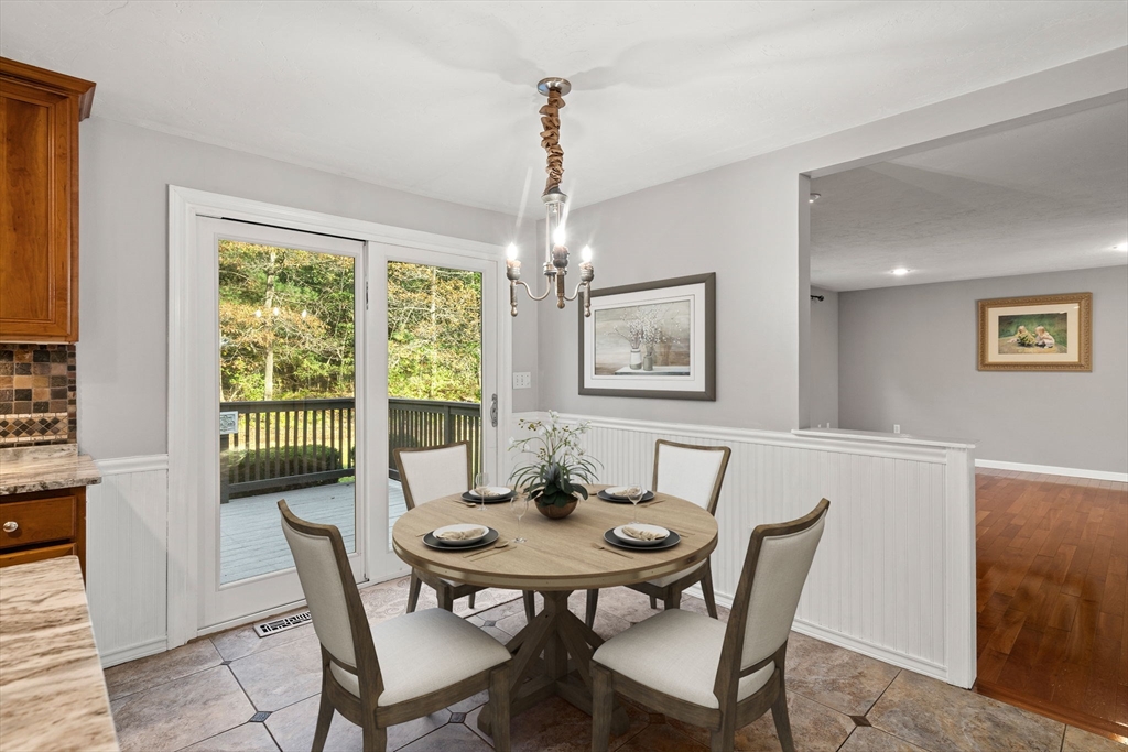 23 Morrison Lane Westford, MA 01886 - Photo 9 of 37 a view of a dining room with furniture window and wooden floor