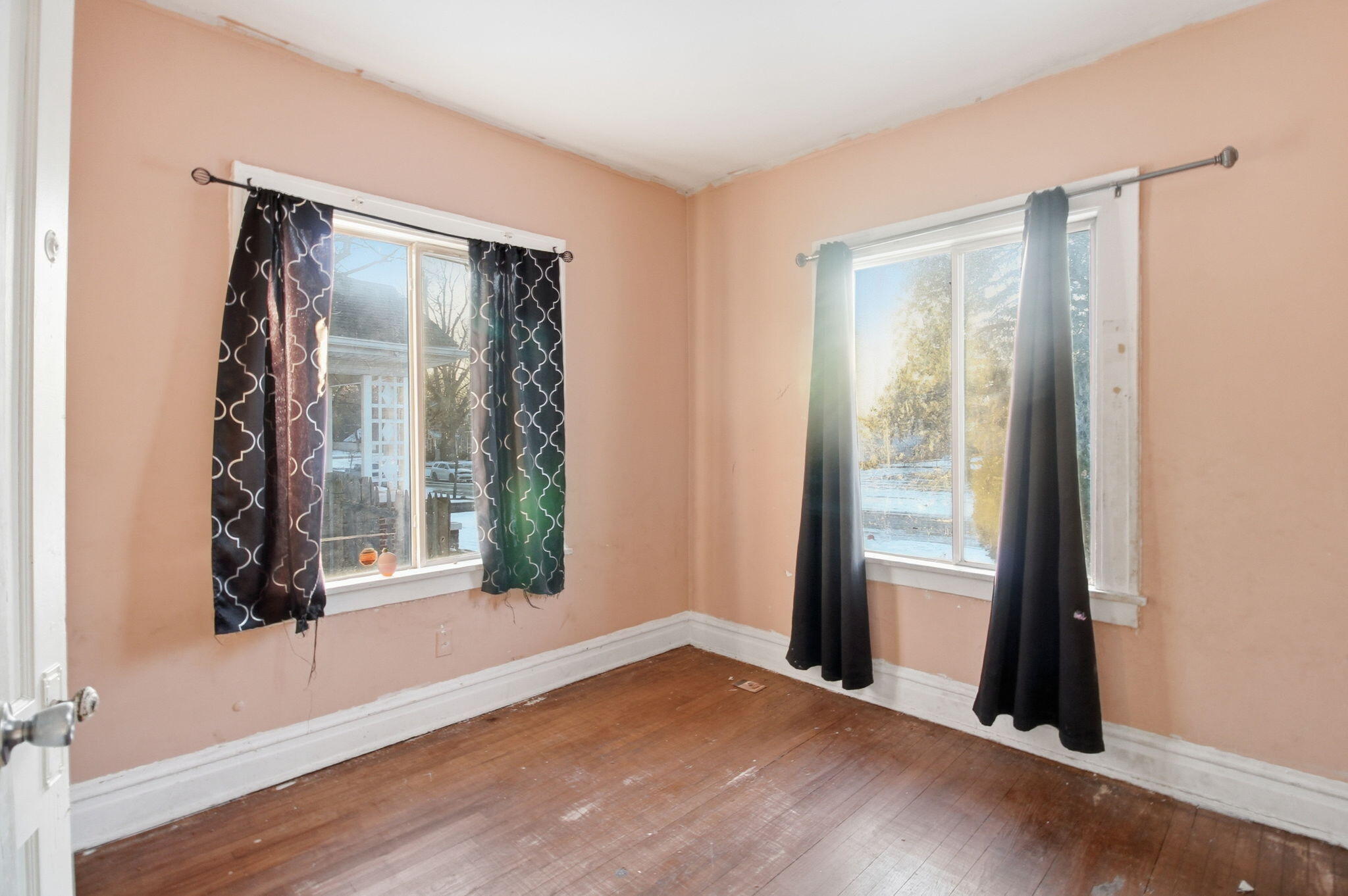 4427 Washington Street Gary, IN 46408 - Photo 6 of 9 an empty room with wooden floor and windows