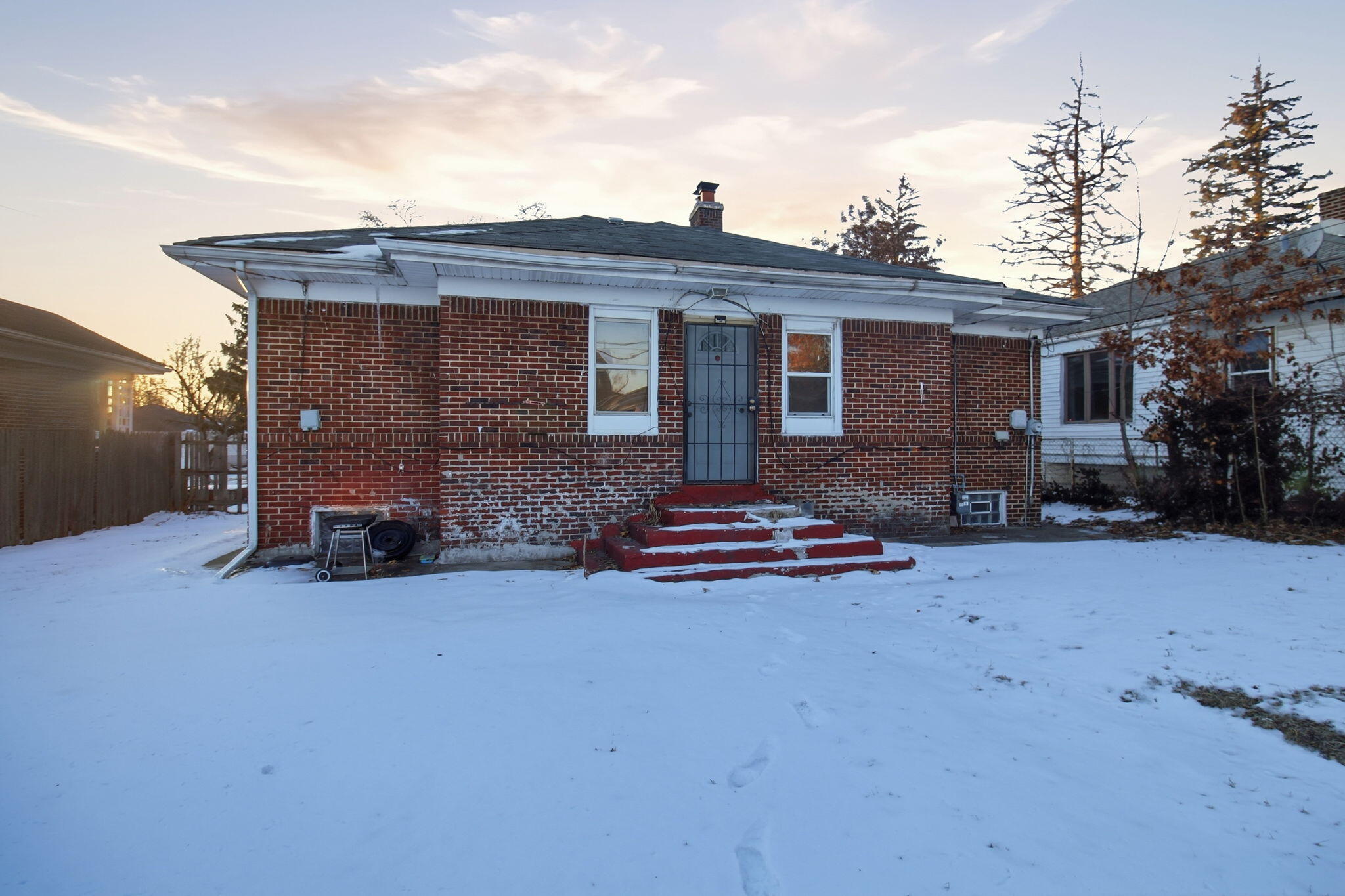 4427 Washington Street Gary, IN 46408 - Photo 9 of 9 a front view of a house with a yard