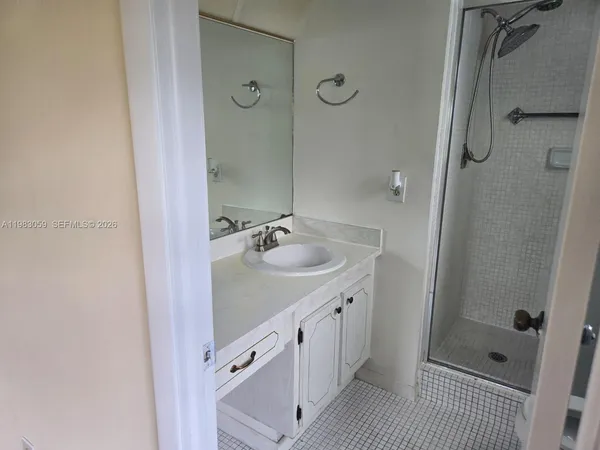 a bathroom with a double vanity sink and mirror