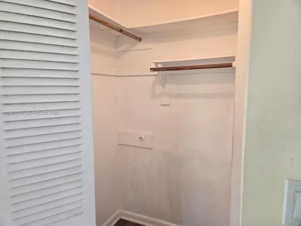 a white toilet sitting next to a bath tub