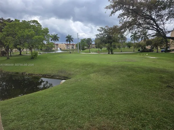 a view of house with yard in front of house
