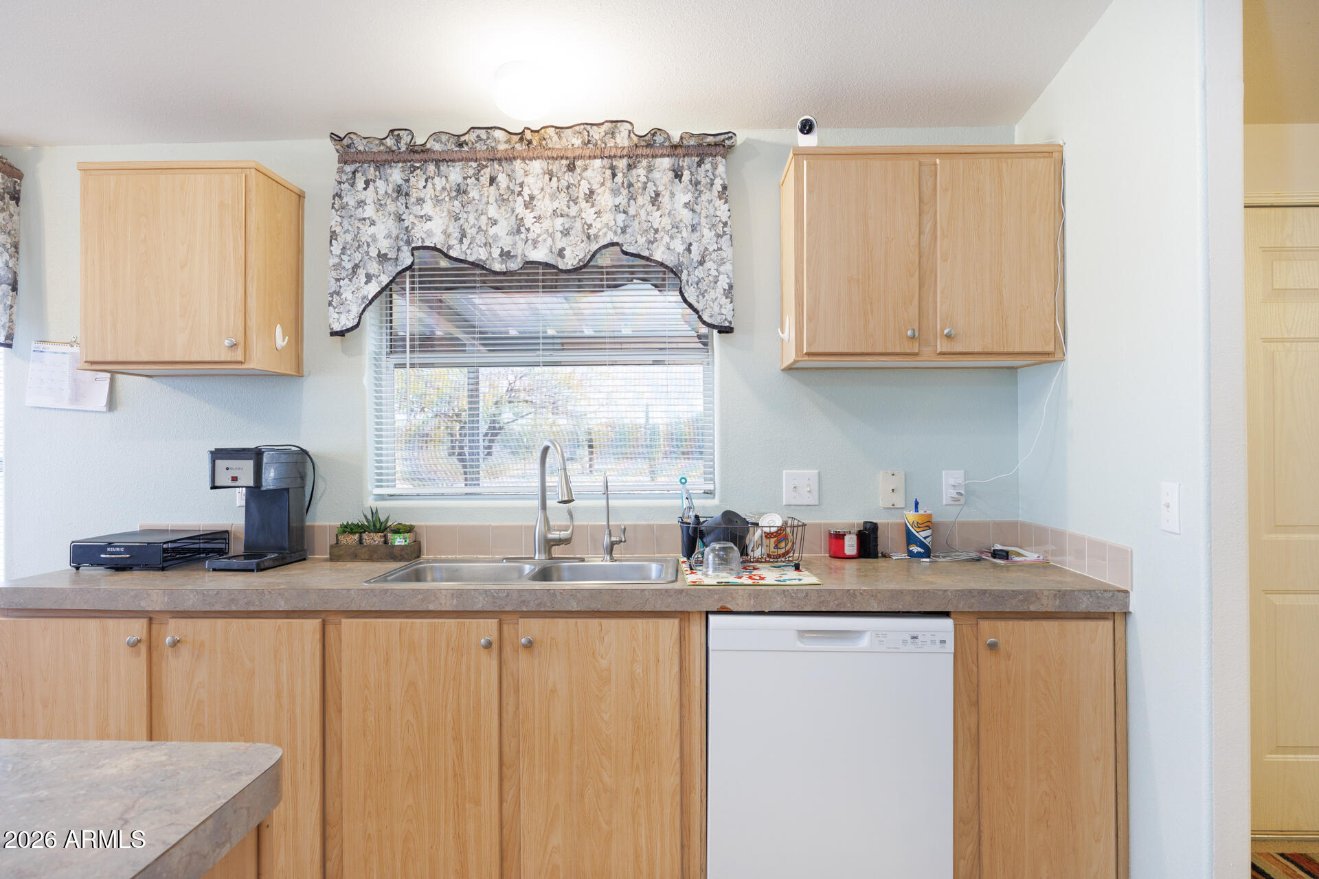 7312 North Reed Road Florence, AZ 85132 - Photo 12 of 66 a kitchen with stainless steel appliances granite countertop a sink stove and cabinets