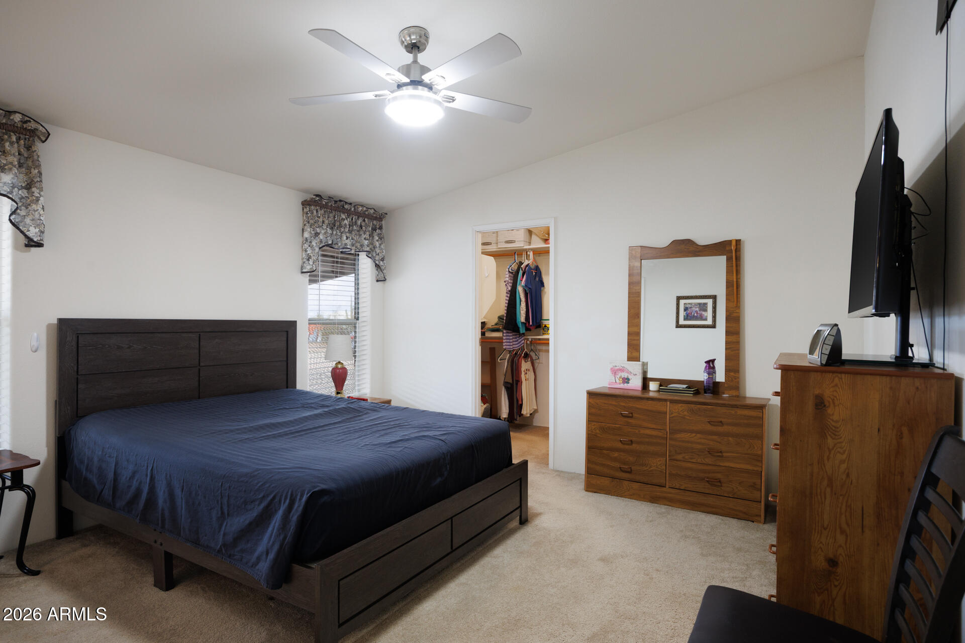 7312 North Reed Road Florence, AZ 85132 - Photo 16 of 66 a bedroom with a bed and flat screen tv
