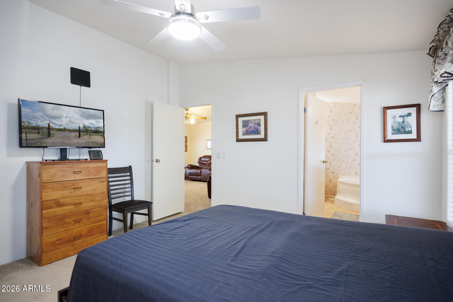 7312 North Reed Road Florence, AZ 85132 - Photo 17 of 66 a bedroom with a bed and furniture