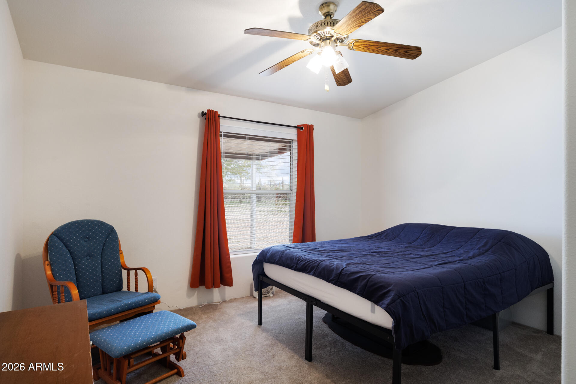 7312 North Reed Road Florence, AZ 85132 - Photo 22 of 66 a bedroom with a bed and wooden floor