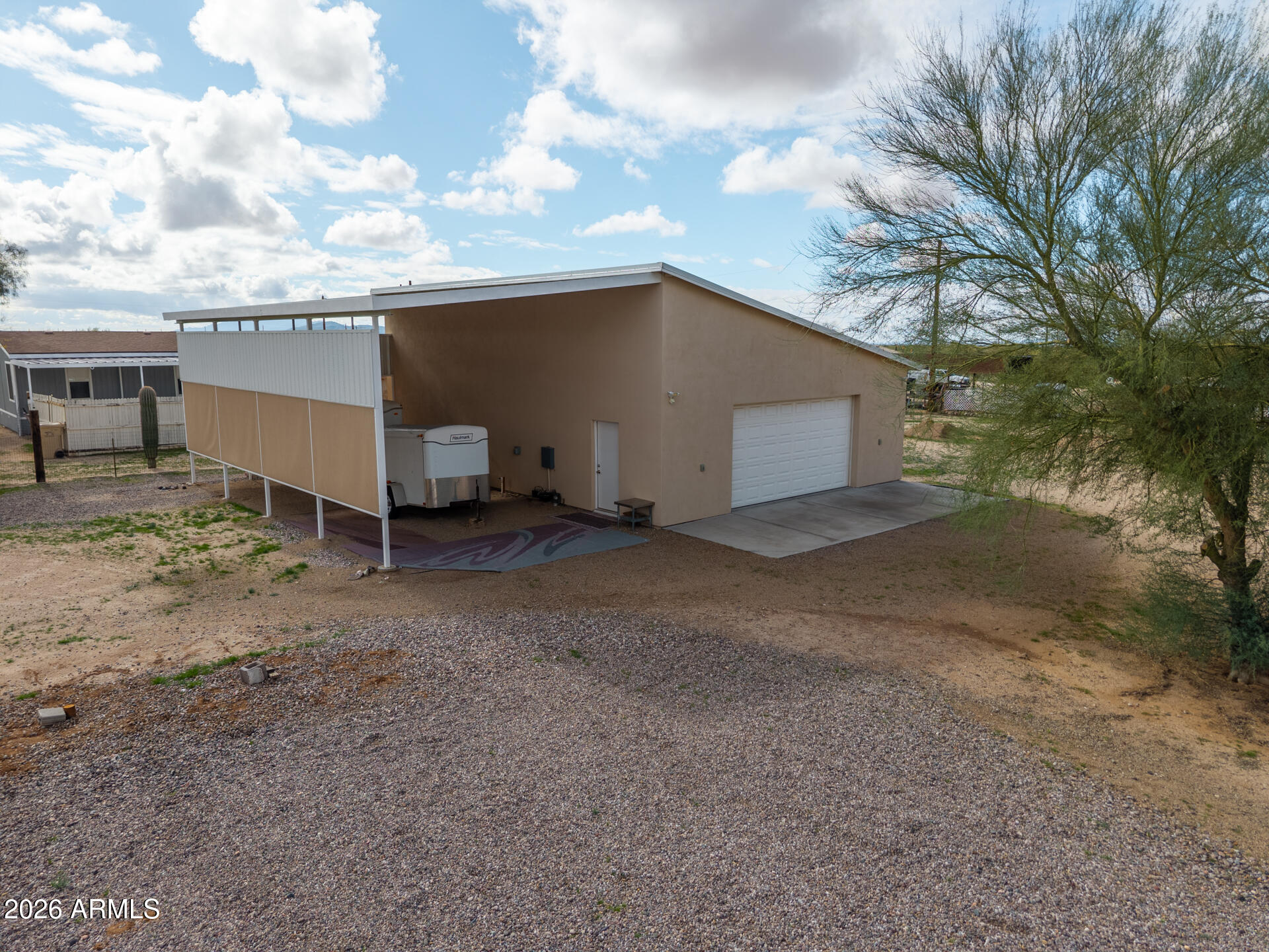 7312 North Reed Road Florence, AZ 85132 - Photo 31 of 66 a view of a house with backyard and garage