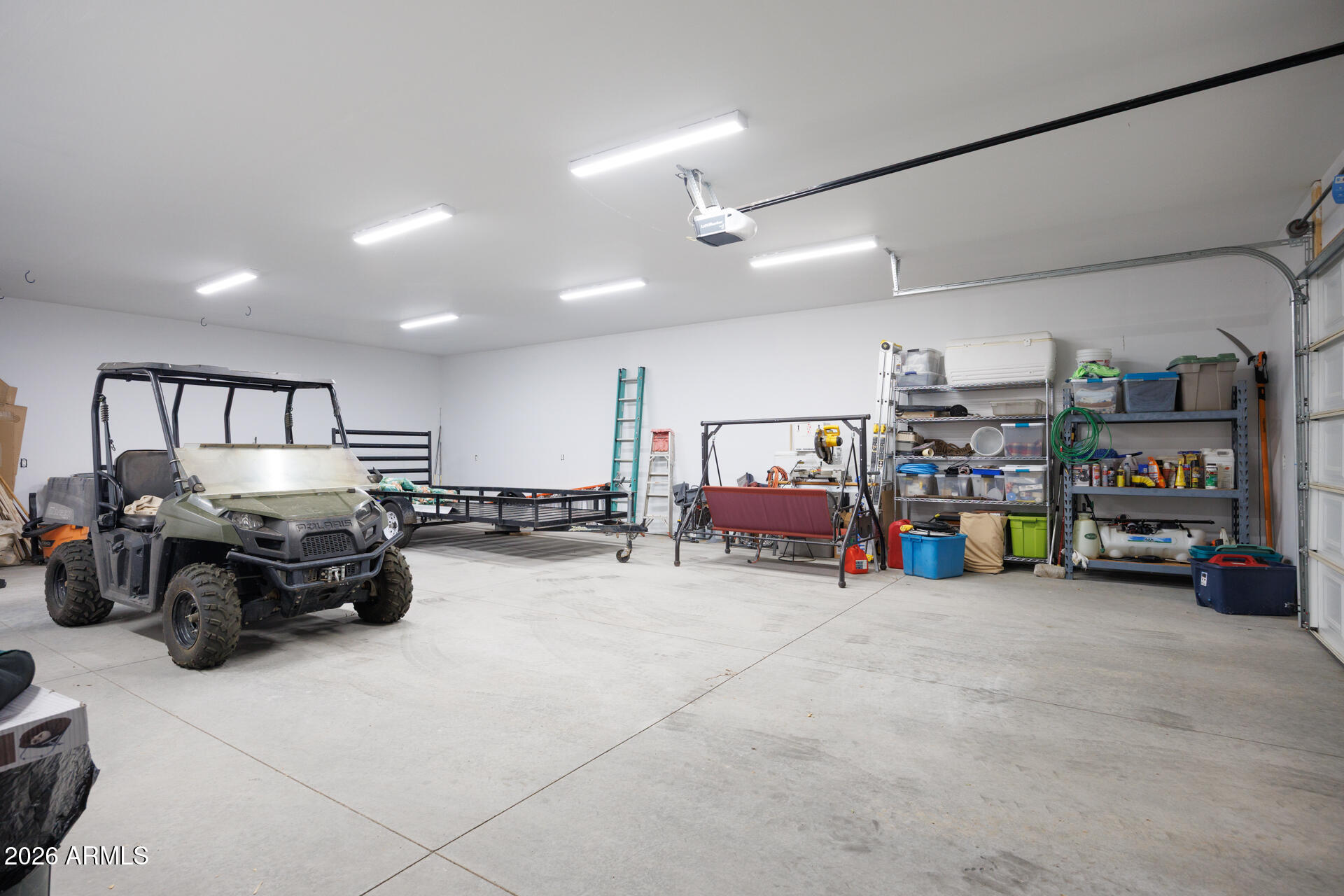 7312 North Reed Road Florence, AZ 85132 - Photo 36 of 66 a room with lots of furniture and white walls