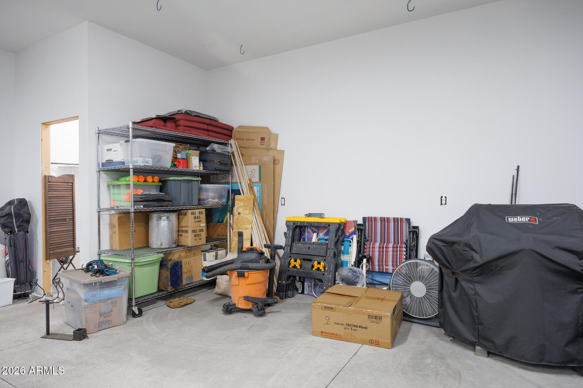 7312 North Reed Road Florence, AZ 85132 - Photo 37 of 66 a living room with furniture and a chandelier