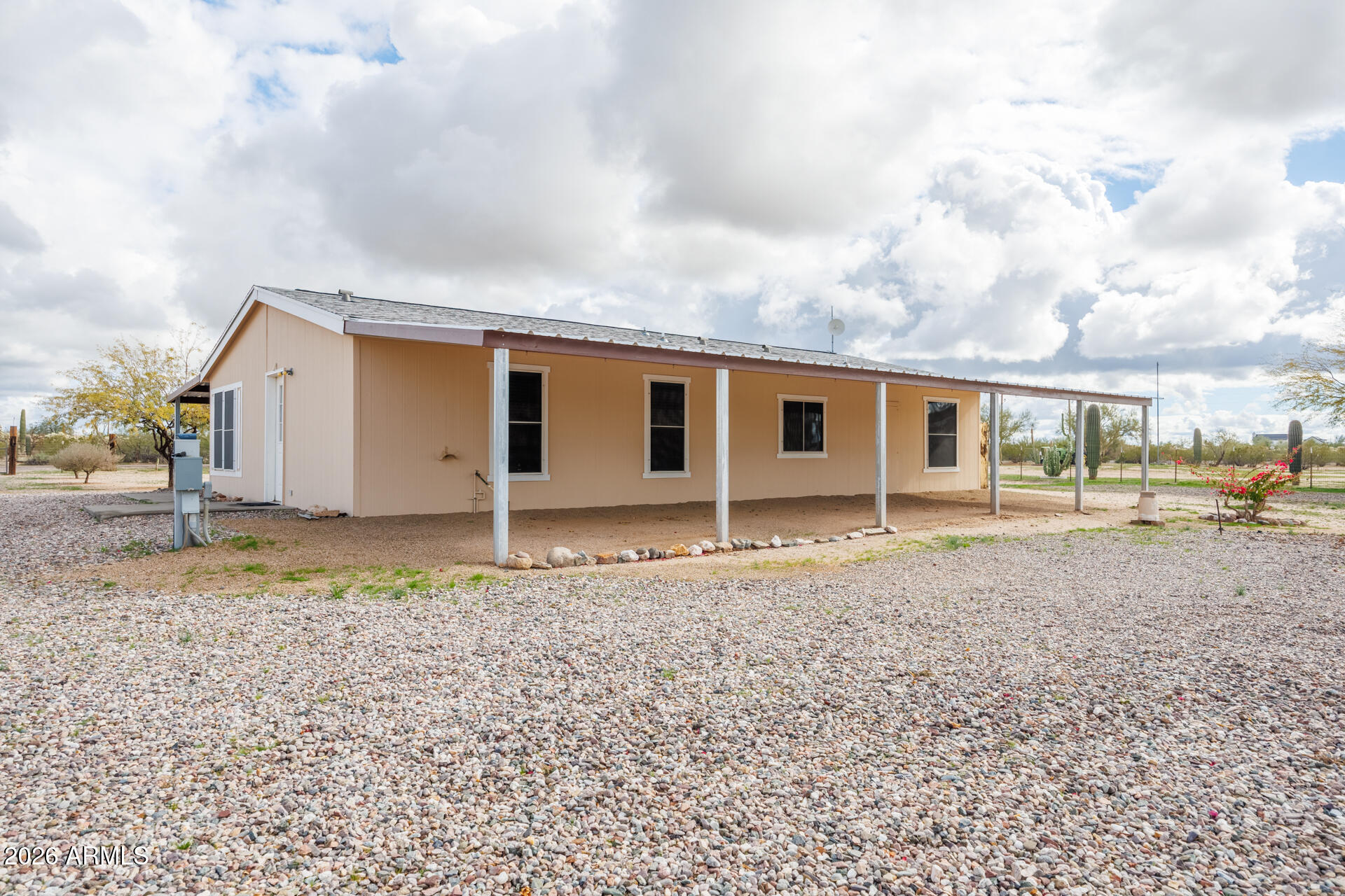 7312 North Reed Road Florence, AZ 85132 - Photo 56 of 66 a backyard of a house with wooden fence and balcony