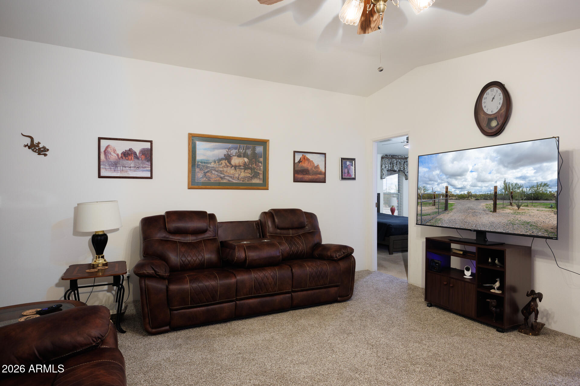 7312 North Reed Road Florence, AZ 85132 - Photo 8 of 66 a living room with furniture and a flat screen tv