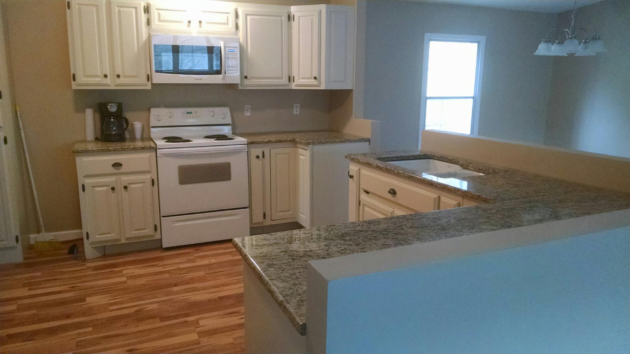 1917 Terrapin Branch Road Mount Pleasant, TN 38474 - Photo 6 of 27 Oak cabinets Stove and microwave remain