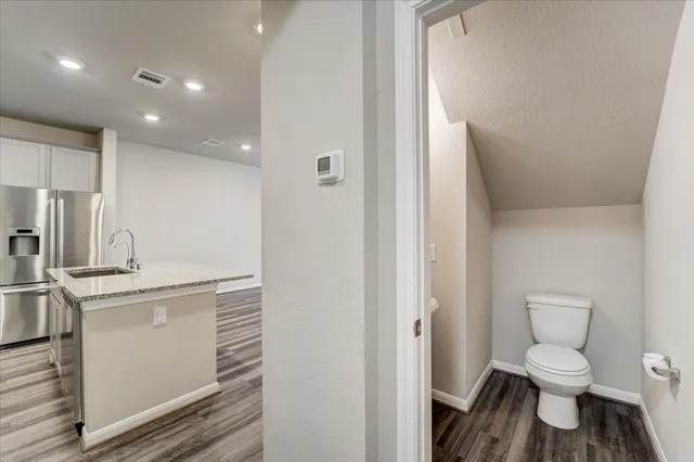 a bathroom with a toilet sink and a shower