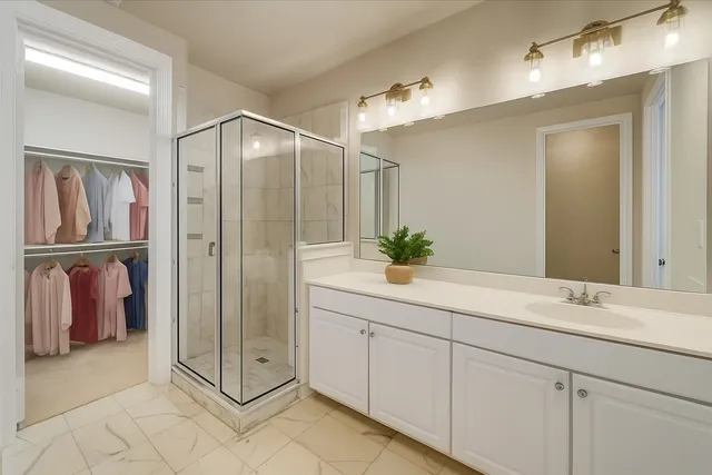 a bathroom with a double vanity sink and a mirror