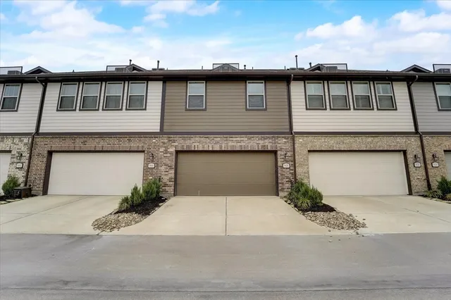 a front view of building with yard