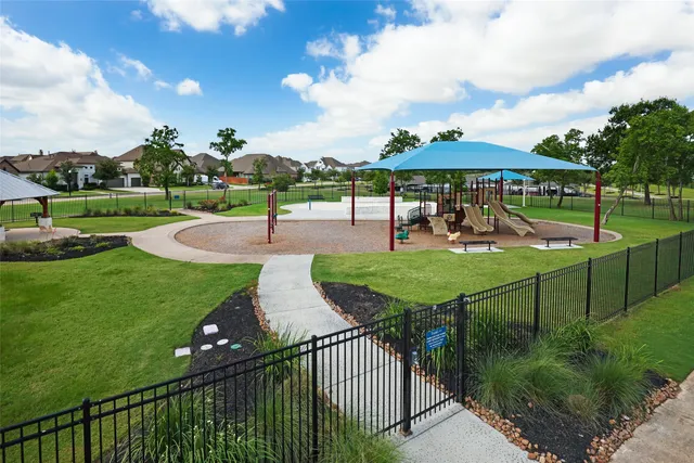 a view of a backyard with sitting area
