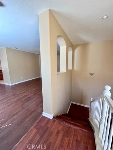 a view of wooden floor in an empty room