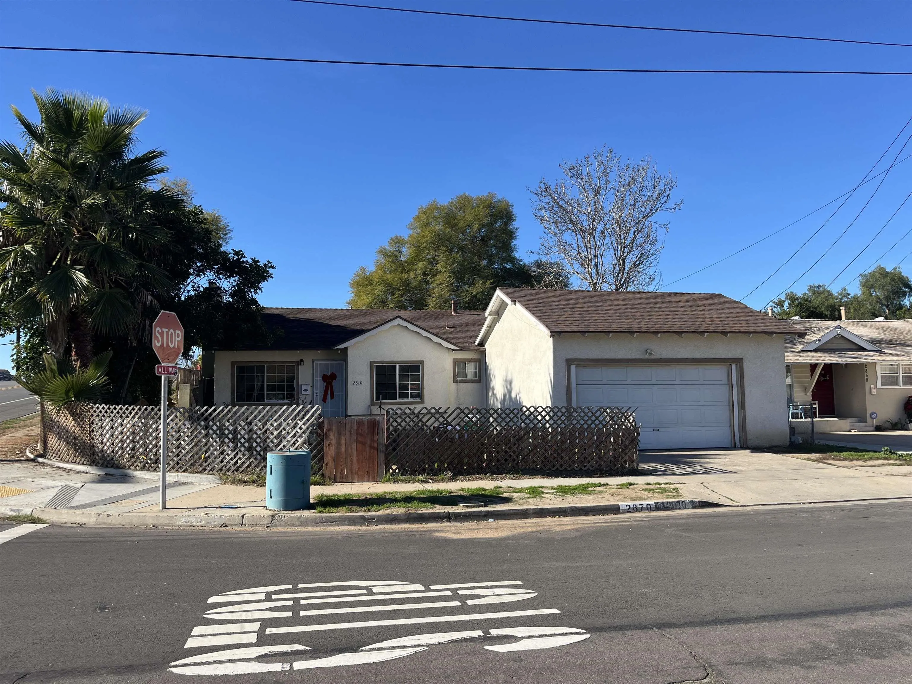 2870 Manos Drive San Diego, CA 92139 - Photo 2 of 7 a front view of a house with a yard