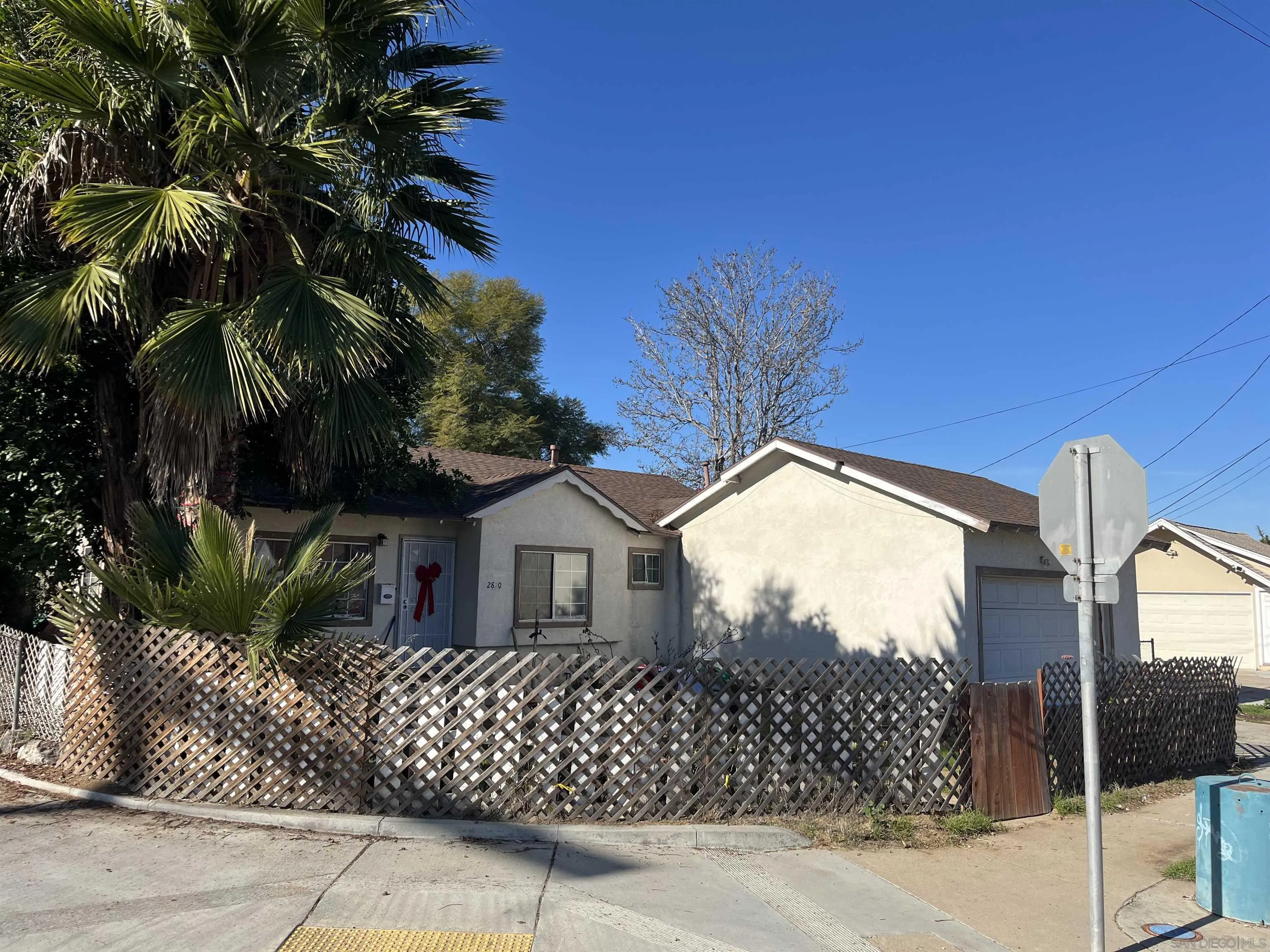 2870 Manos Drive San Diego, CA 92139 - Photo 3 of 7 a view of a house with a small garden