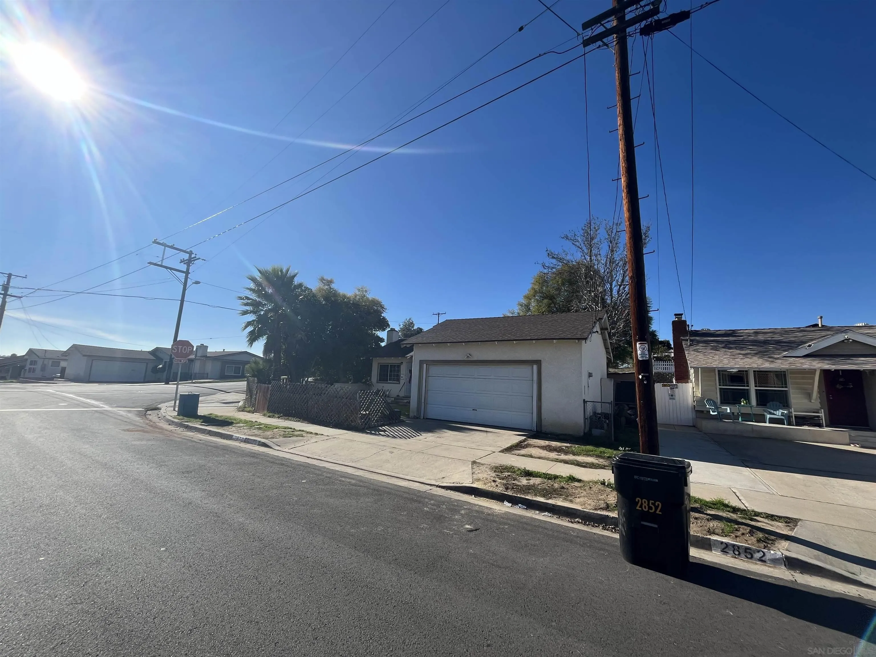 2870 Manos Drive San Diego, CA 92139 - Photo 4 of 7 a wooden bench sitting in front of a building