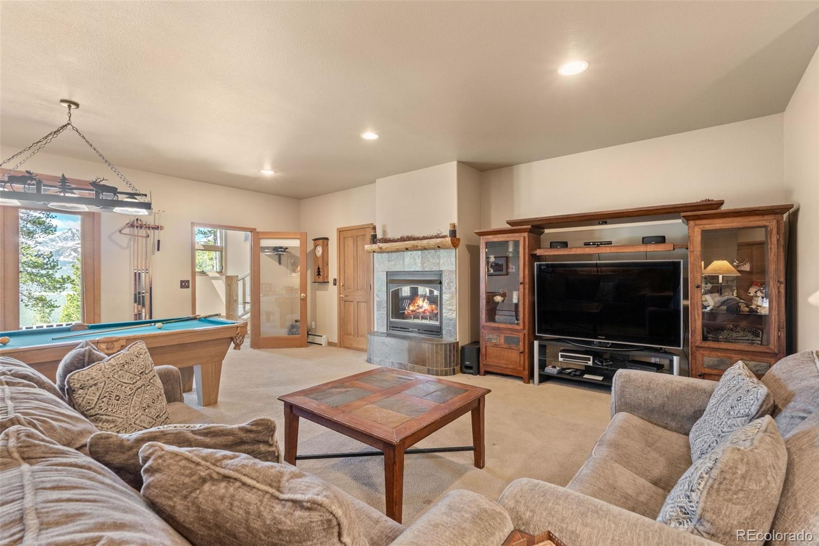 92 Emmett Lode Road, Unit B Breckenridge, CO 80424 - Photo 27 of 50 a living room with furniture and a flat screen tv