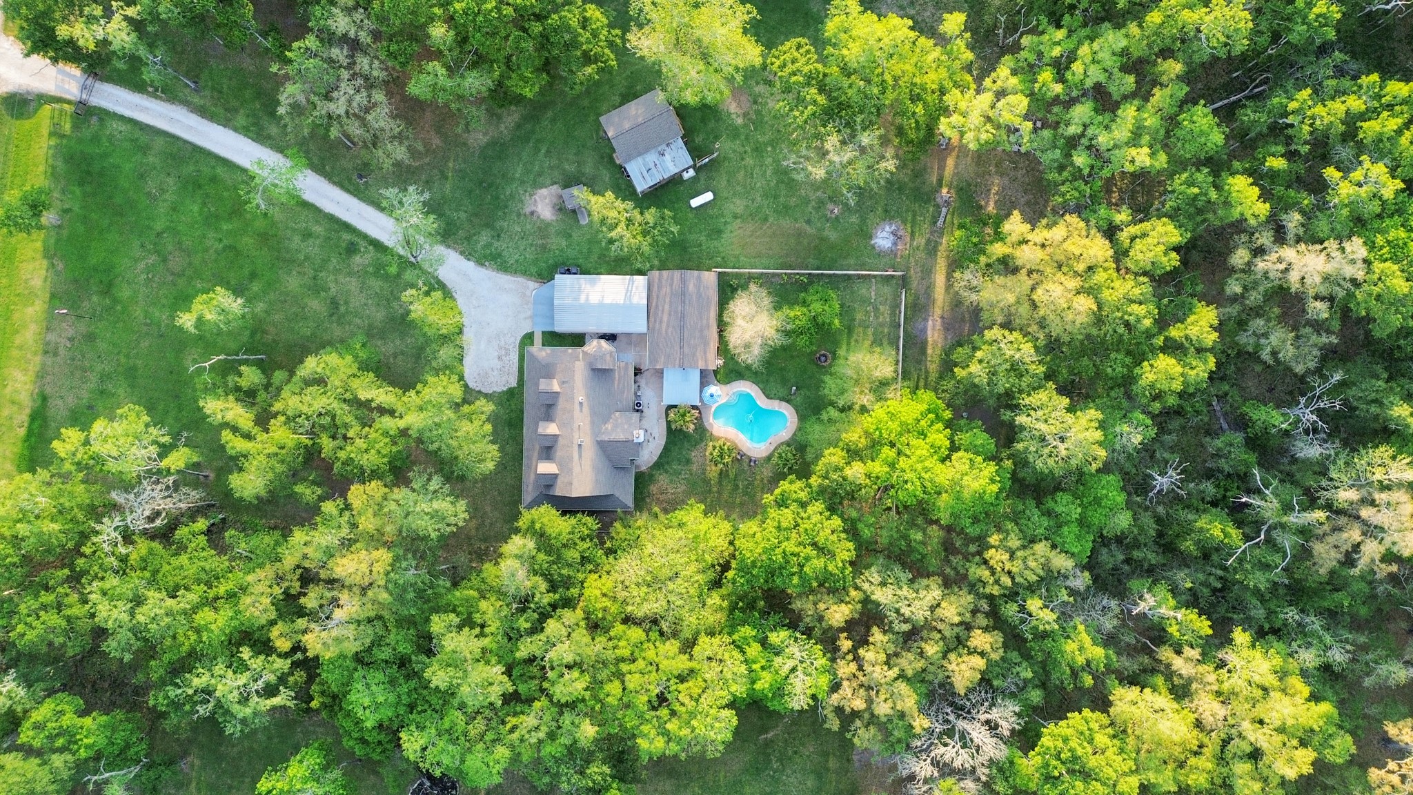 20202 Deer Run Road Damon, TX 77430 - Photo 42 of 45 From above, the property unfolds into a perfect blend of home, land, and outdoor living.