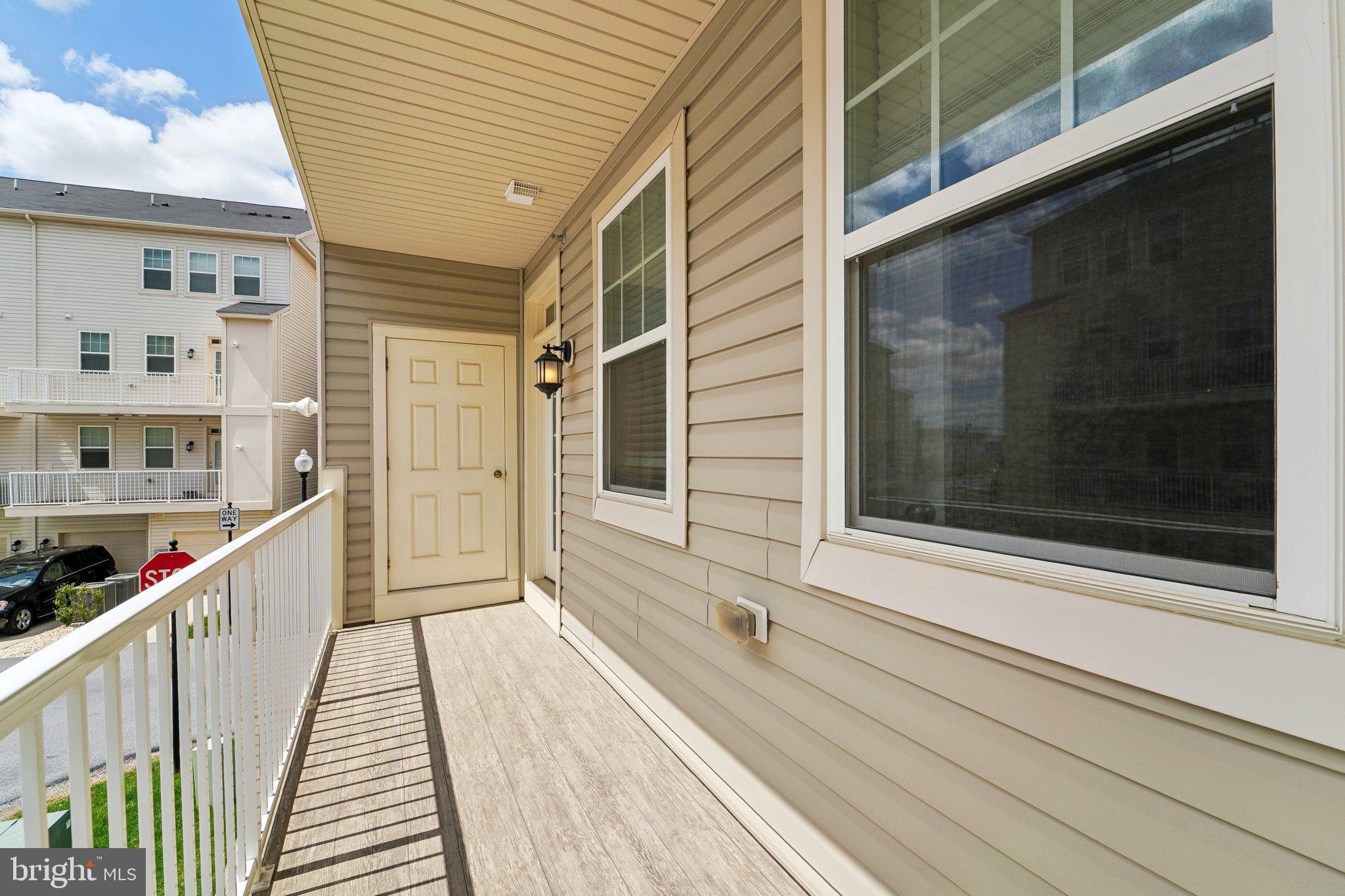 7101 Macon Street Frederick, MD 21703 - Photo 28 of 38 a view of a balcony with wooden floor and fence