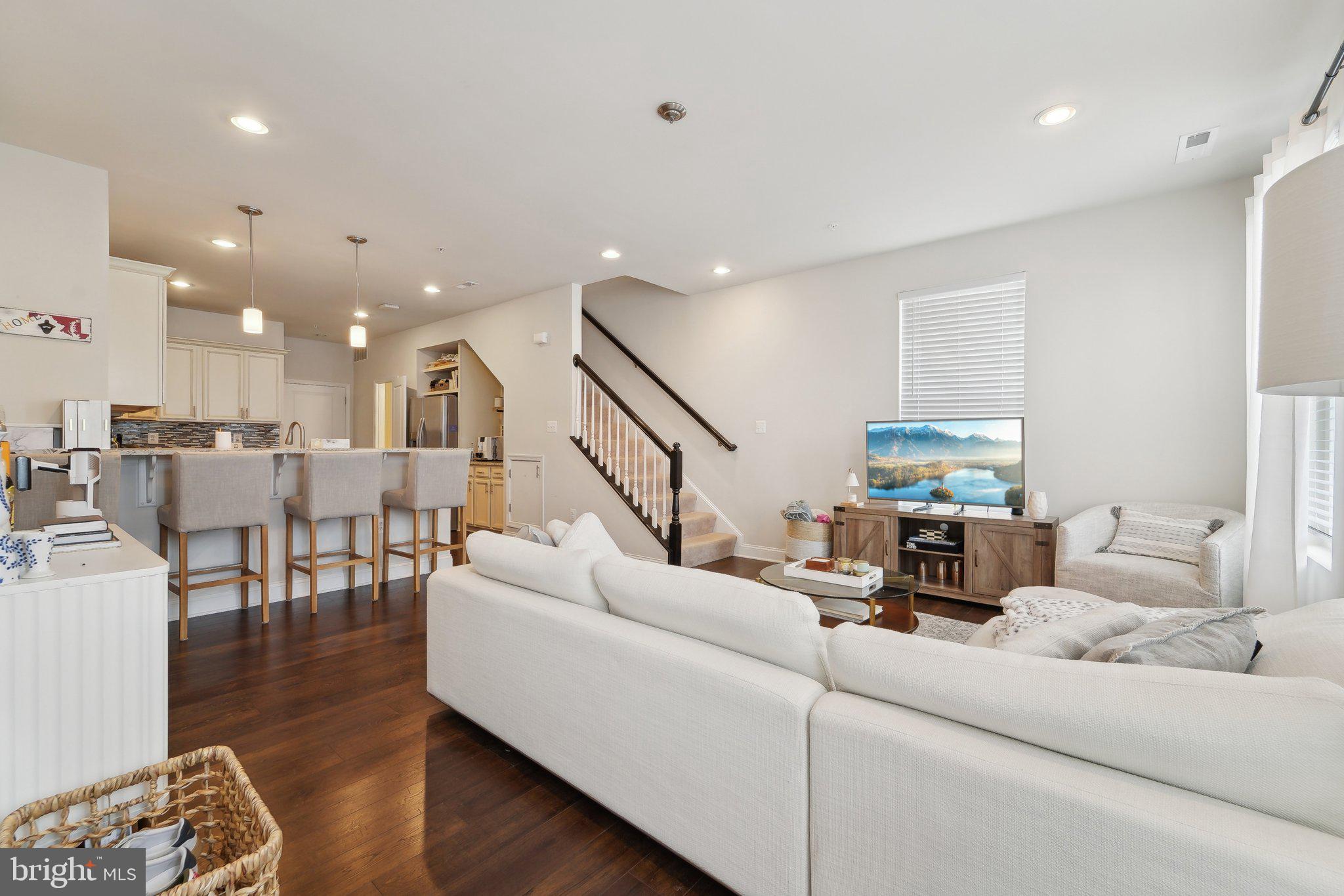 7101 Macon Street Frederick, MD 21703 - Photo 7 of 38 a living room with furniture and wooden floor